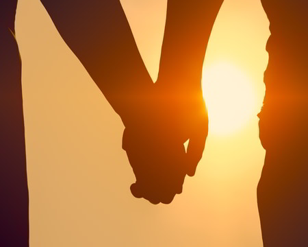 couples counselling retreat success hold hands sunset